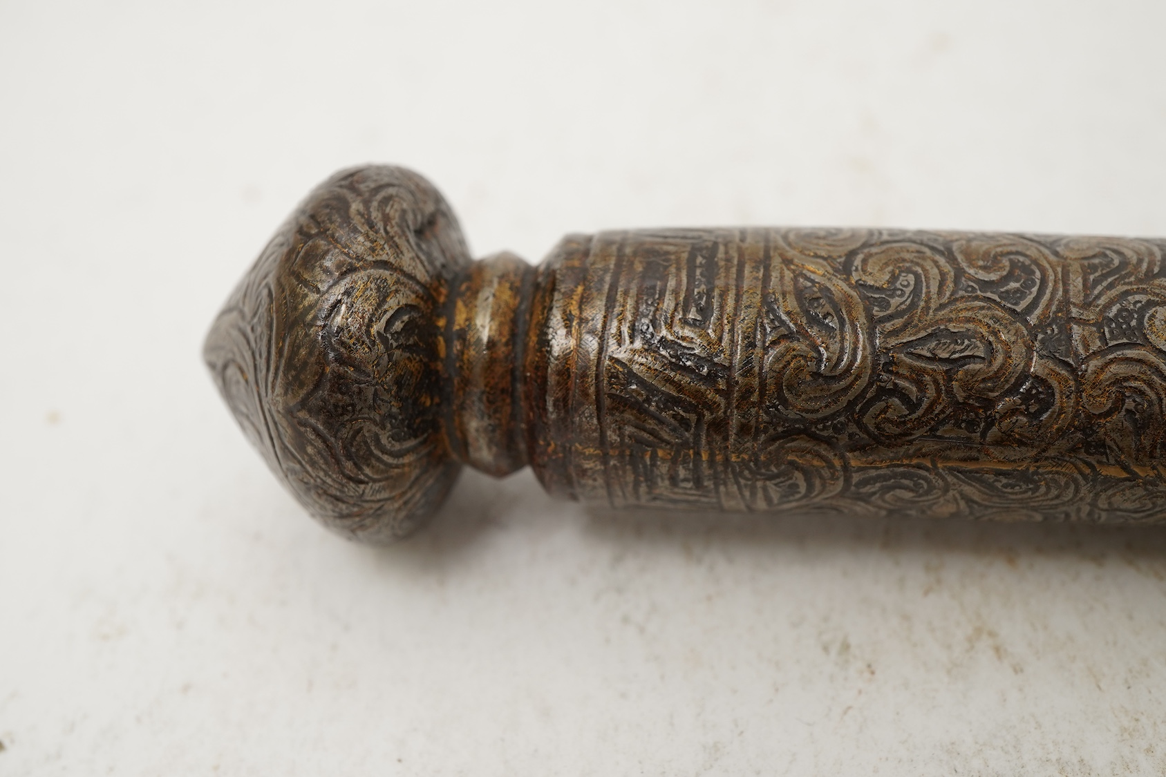 A Tibetan damascened iron scroll holder, 17th century